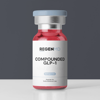 Semaglutide, a compounded GLP-1, is a red liquid inside a peptide vial, with the bottle set in front of a dark grey background.