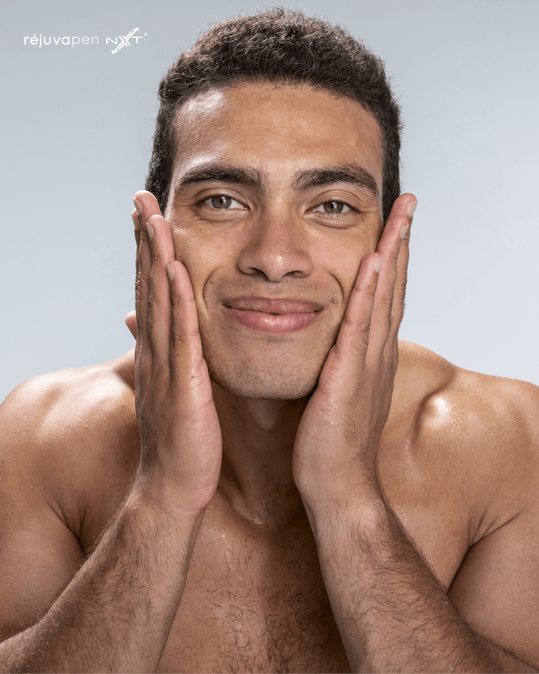 A man washes his face to indicate healthy glowing skin after a microneedling treatment.