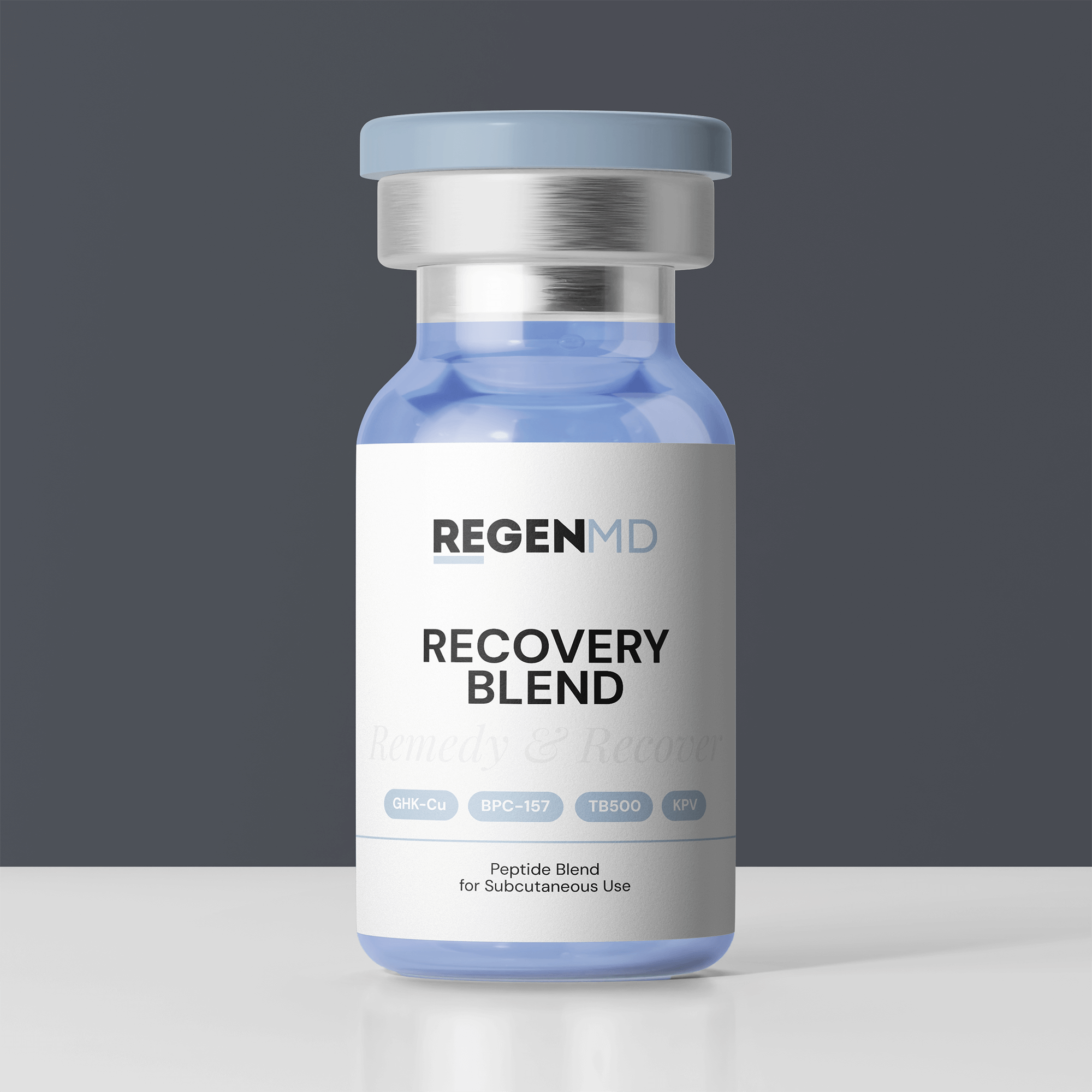 The Recovery Blend peptide, a blue liquid inside the vial, with the bottle set against a dark grey background.