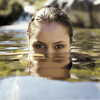 An attractive woman arises from the water as a metaphor for anti-aging and "fountain of youth."